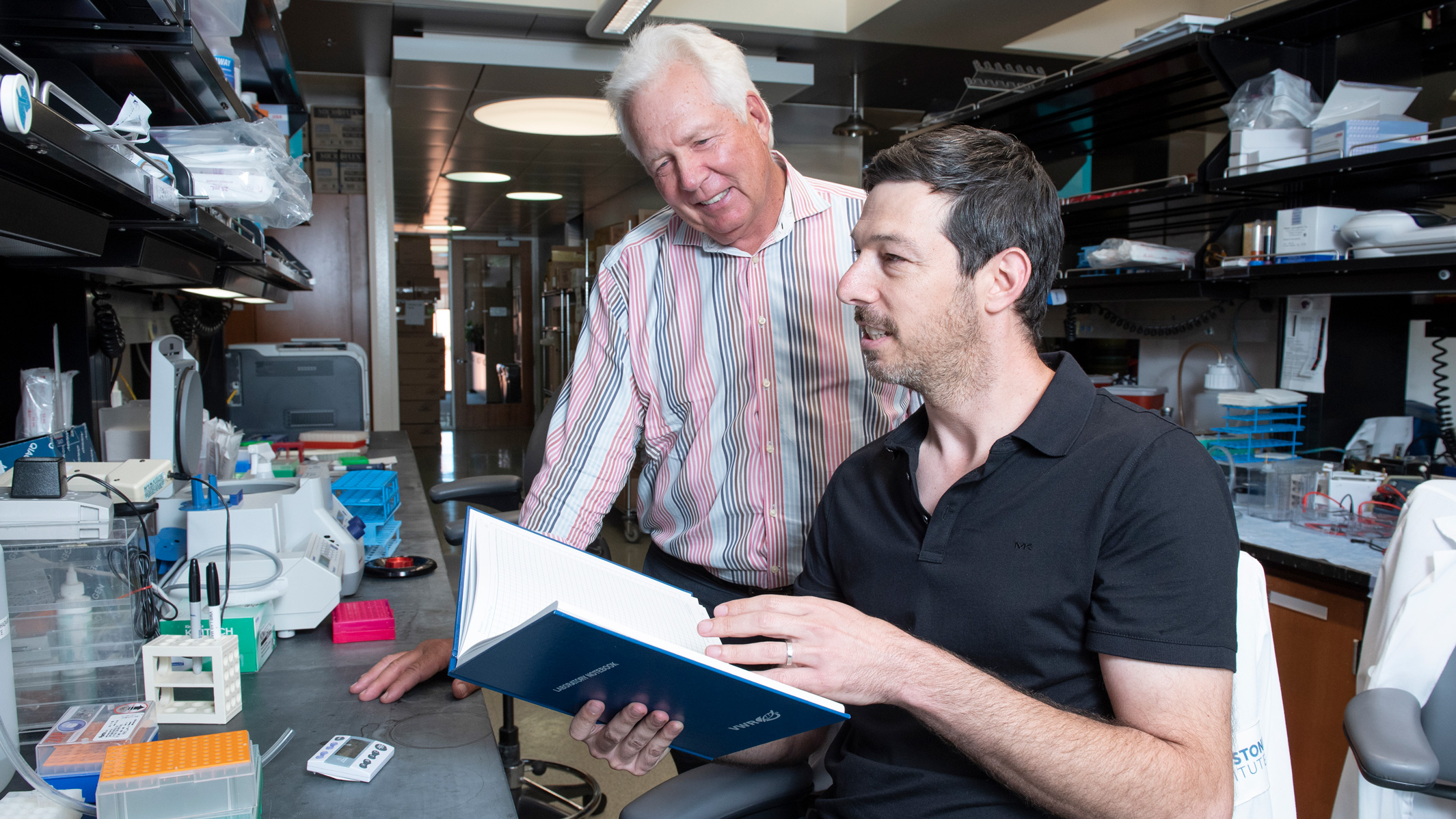 Two scientists talking in the lab