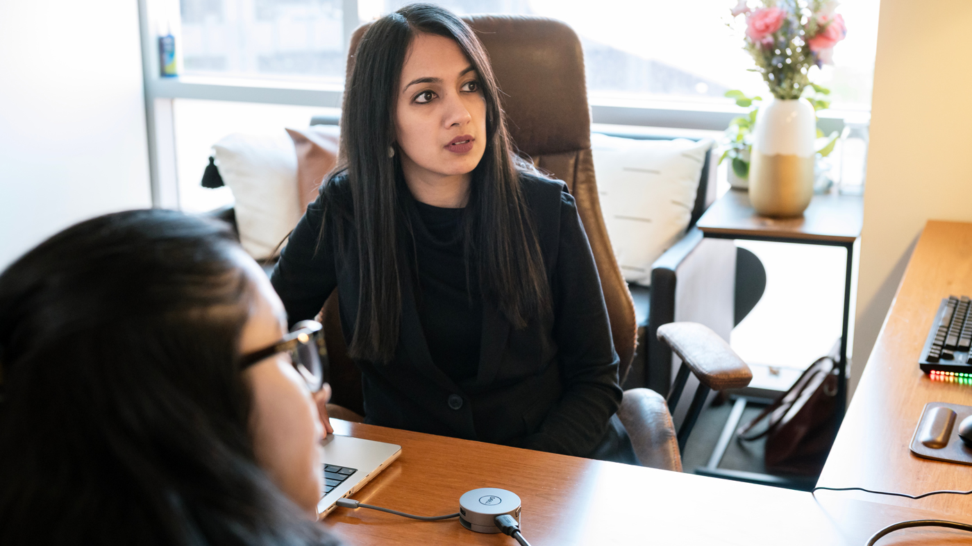 Isha Jain in her office at Gladstone Institutes with Ankur Garg