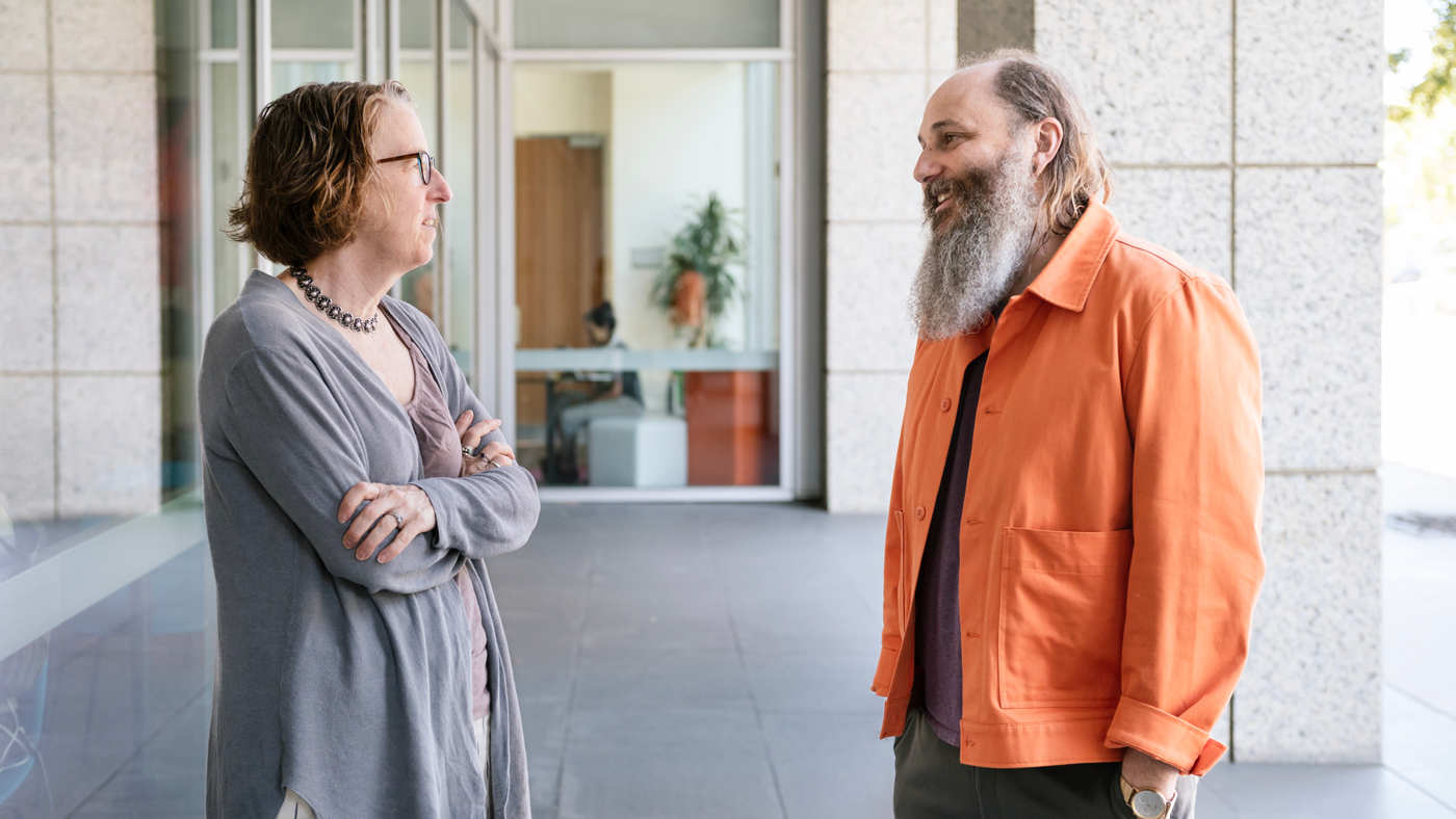 Katie Pollard and Seth Shipman speaking outside Gladstone Institutes
