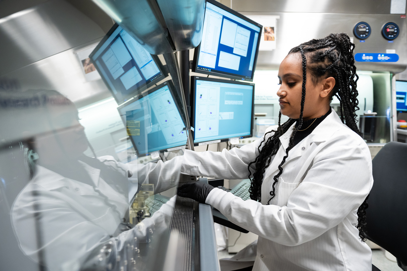 Research Associate Tsion Abay working in a lab at Gladstone