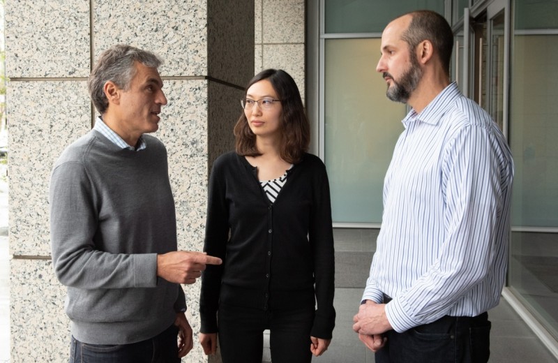 Jorge Palop talking to Keran Ma and Jesse Hanson outside the Gladstone building