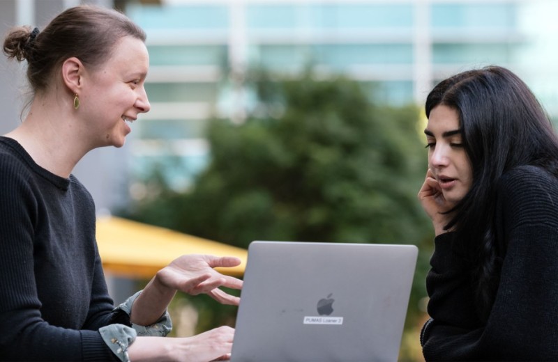 Alicia Roy speaking with a trainee outside Gladstone's building.