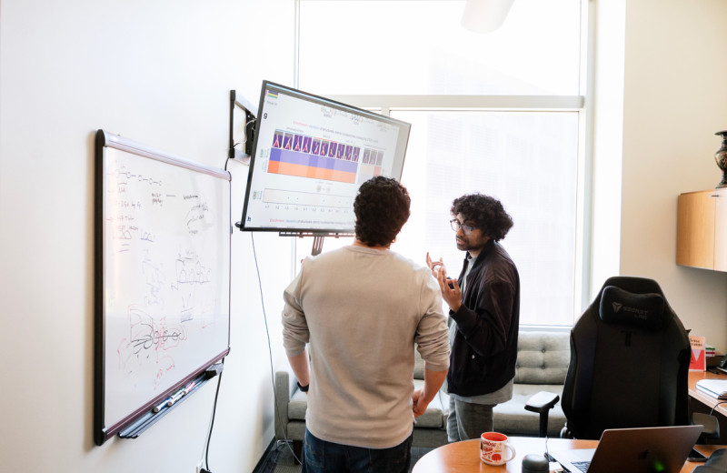 Vijay Ramani and Hani Goodarzi in Ramani's office at Gladstone Institutes