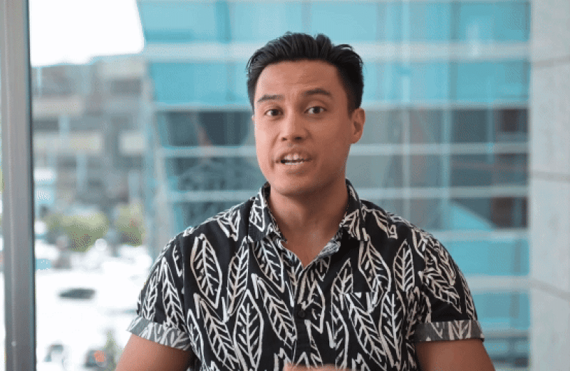 GIF of Kevin Pastores sitting in front of large windows at Gladstone Institutes