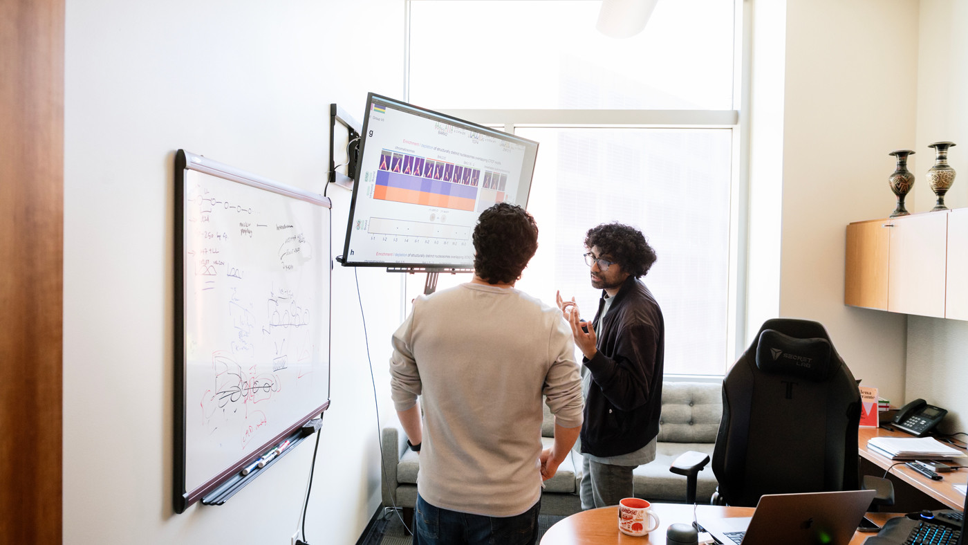 Vijay Ramani and Hani Goodarzi in Ramani's office at Gladstone Institutes
