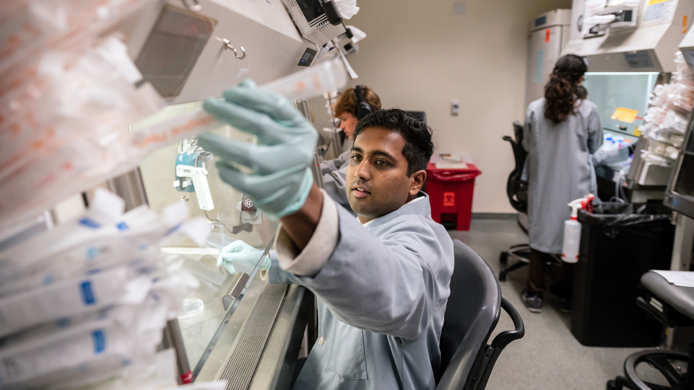 Gokul Ramadoss working in the Stem Cell Core at Gladstone Institutes.