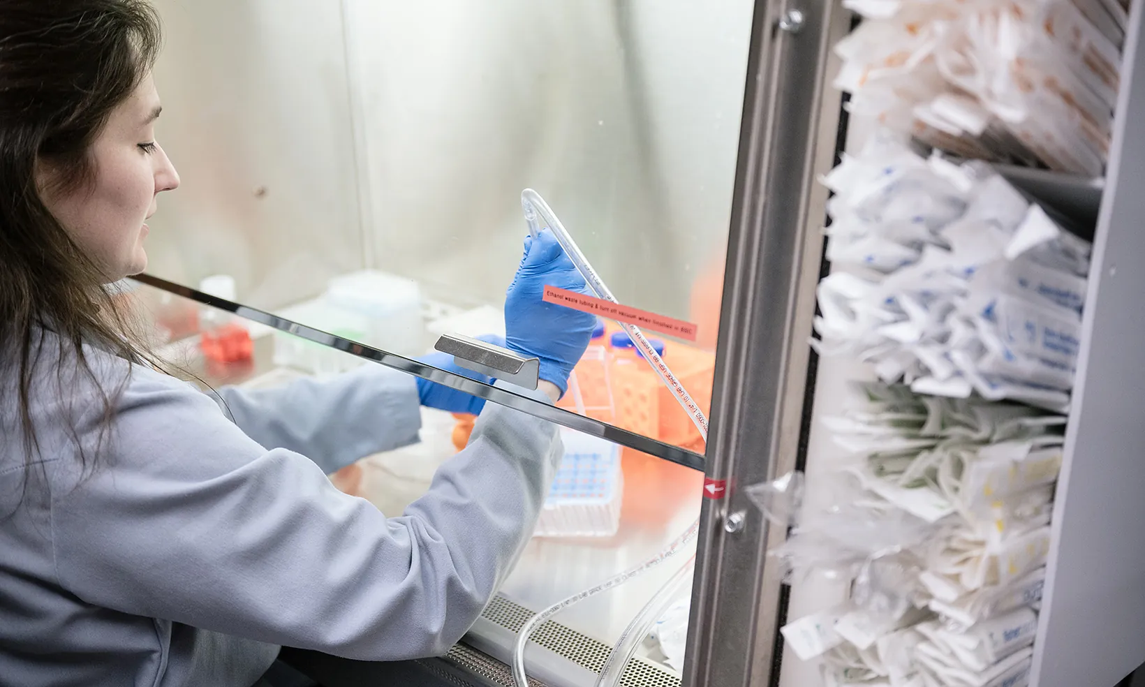 Scientist doing an experiment at a lab bench