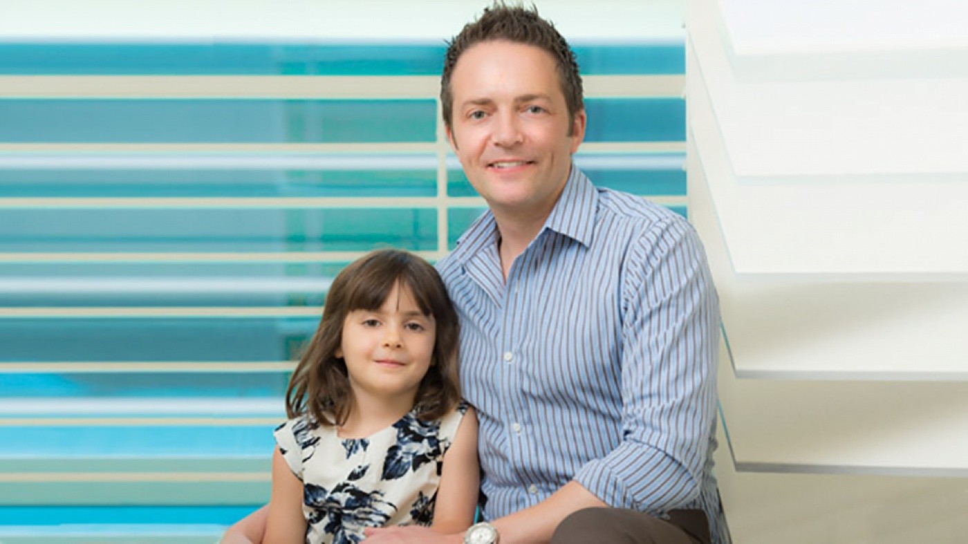 Benoit Bruneau sitting with his daughter Nika