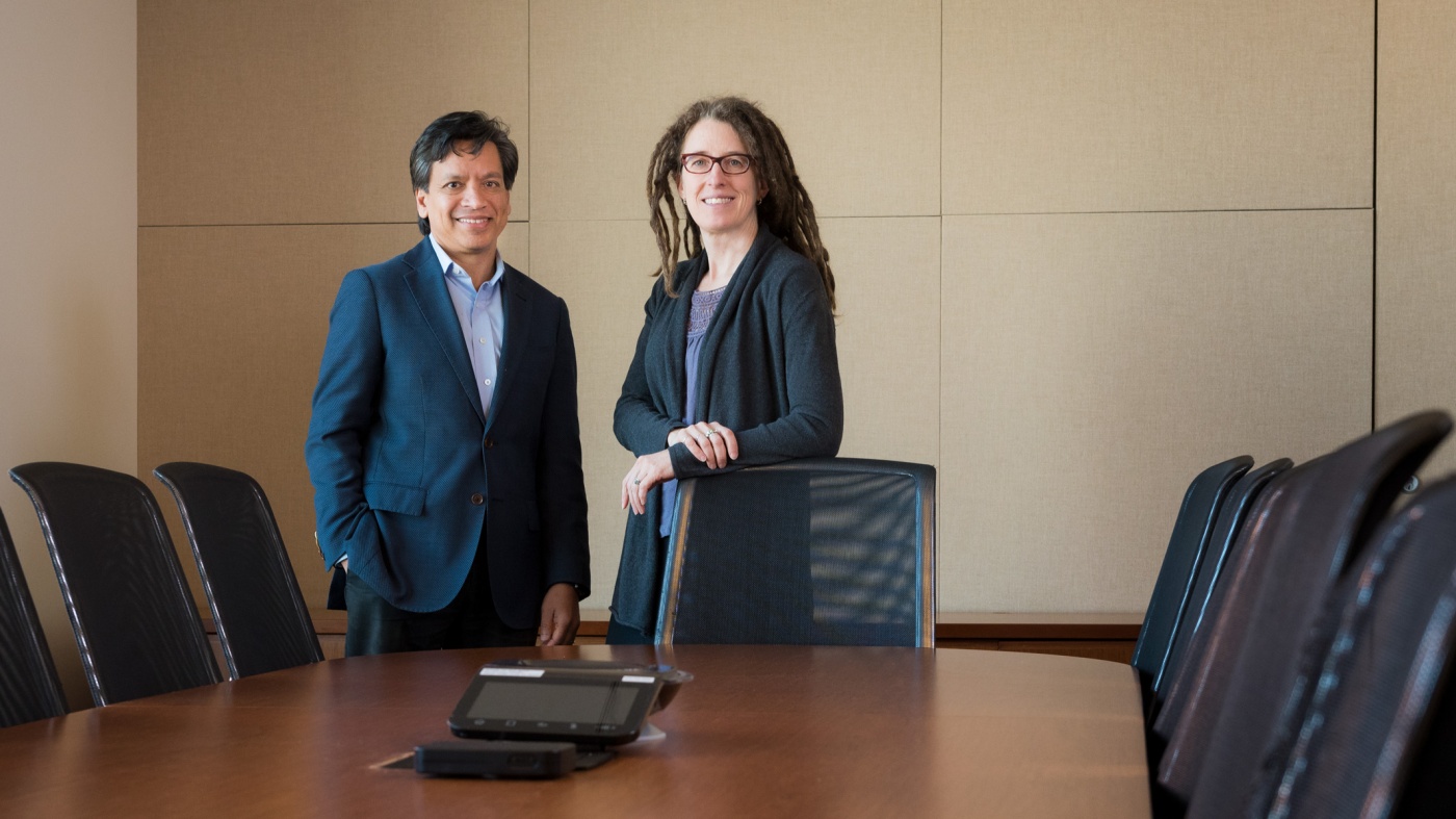 Deepak Srivastava and Katherine Pollard in a conference room