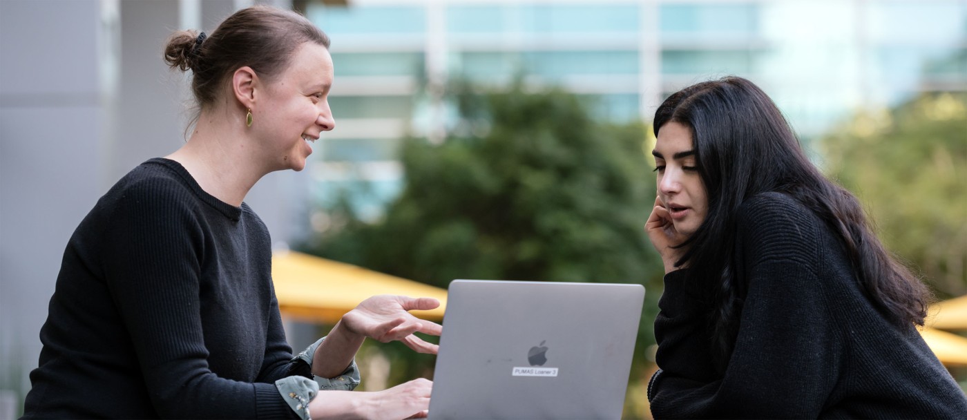 Alicia Roy speaking with a trainee outside Gladstone's building.