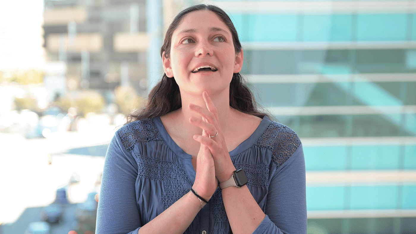 GIF of Sarah Nyquist speaking during a seated interview at Gladstone