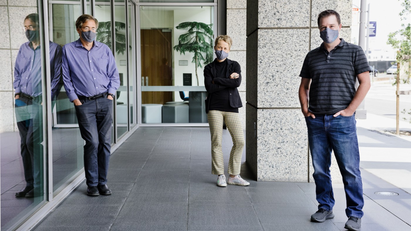 Bruce Conklin, Melanie Ott, and Todd Mcdevitt standing outside the Gladstone building wearing masks