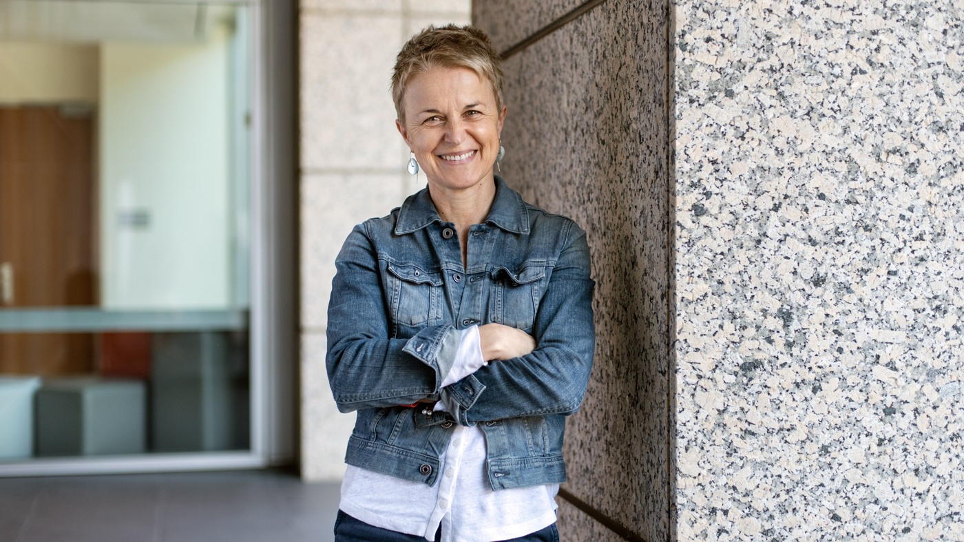 Melanie Ott standing in front of Gladstone Institutes