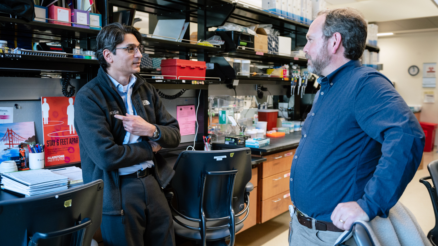 Luke Judge and Irfan Kathyria talking in the lab.