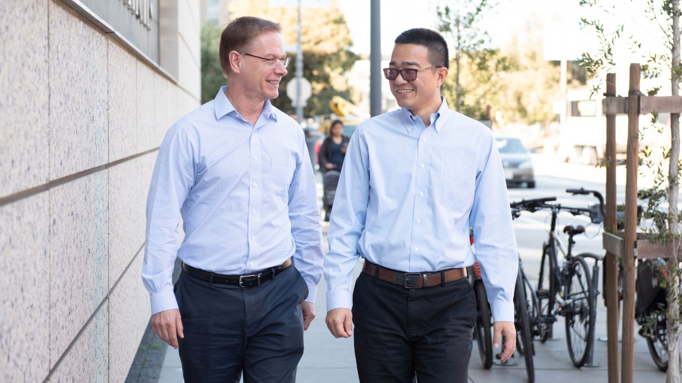 Lennart Mucke and Chao Tai walking down the street and talking to each other