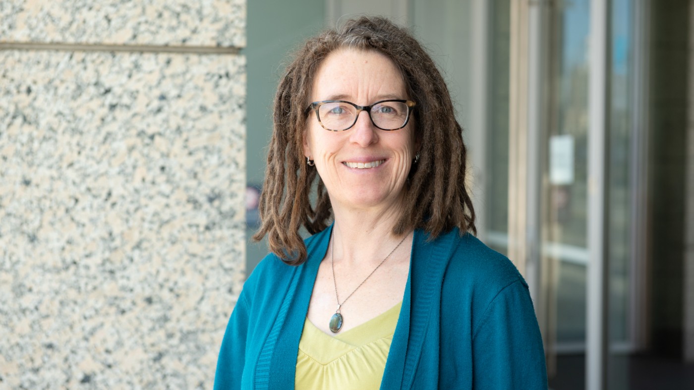 Headshot of Katie Pollard outside the Gladstone building