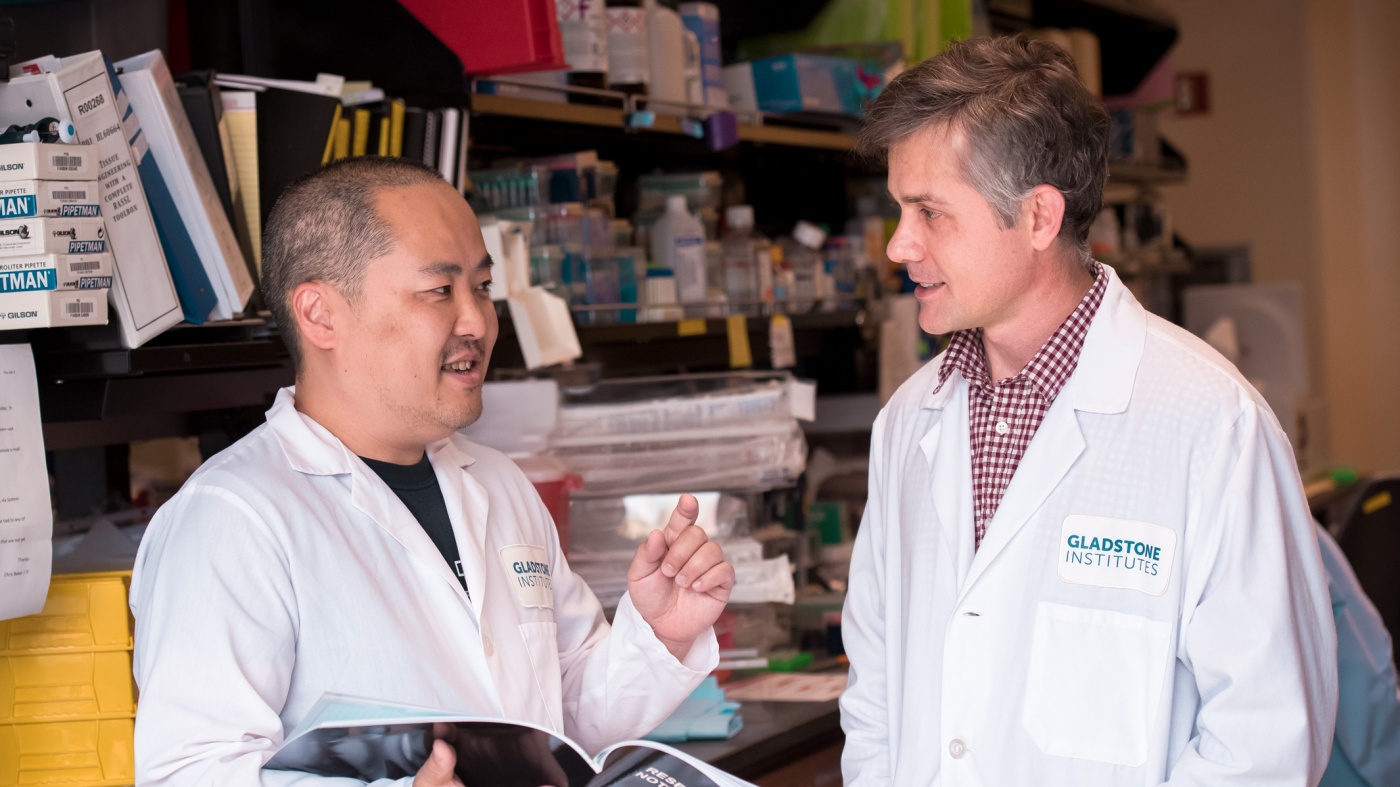 Two scientists talking in the lab